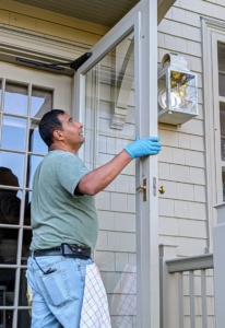 At my Winter House, Carlos installs the storm doors - this one is for my kitchen.