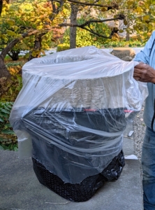 The planter is then carefully covered in plastic. I instructed Pete to make sure he wraps everything completely – that means underneath it as well. The black plastic is a regular garbage bag, which is easy to use on smaller vessels.