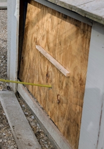Temporary panels kept the space somewhat closed, but the wood could still be pushed giving access to intruders.