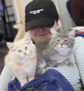 Kathleen Birmingham is foster director in charge of working with hundreds of foster families, coordinating animal care while also ensuring proper placement for new arrivals. Here she is showing off two more adoptees.